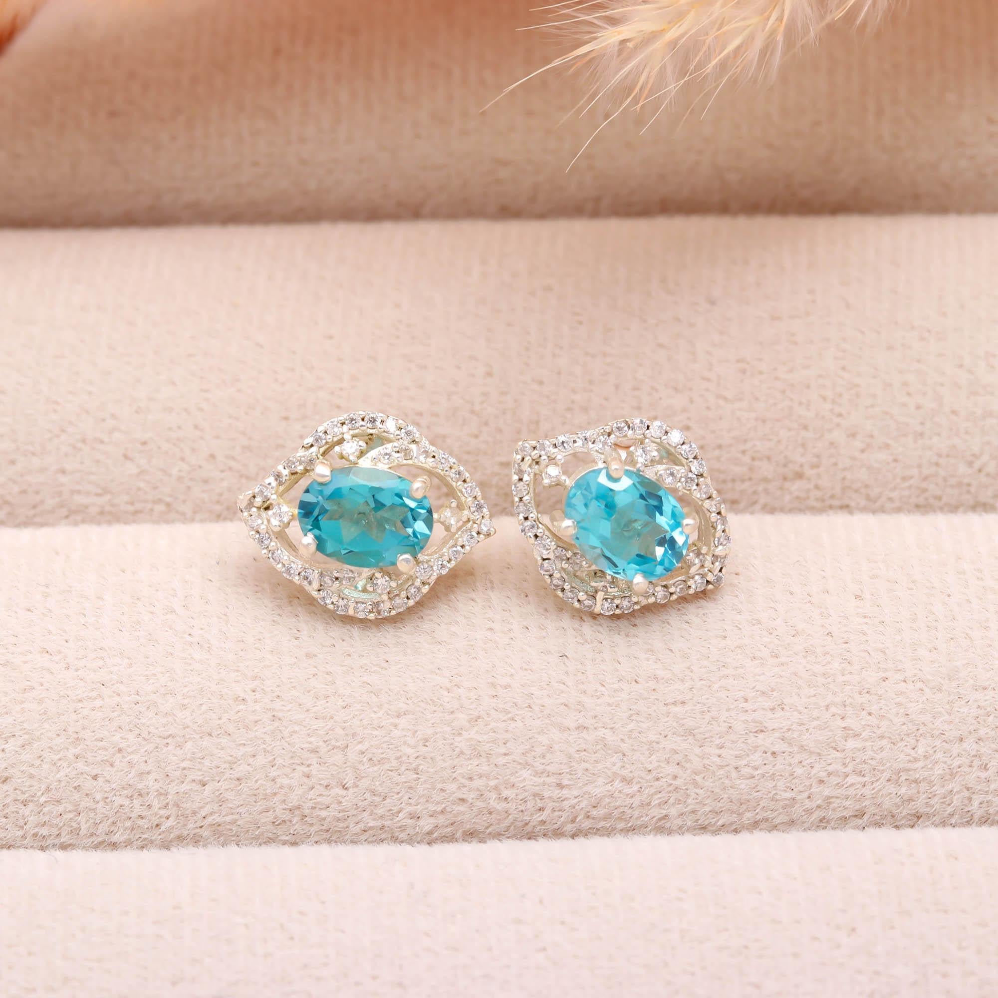 Sky Sparkle: Blue Topaz and Zircon Silver Stud Earrings